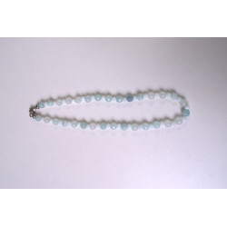 Stone necklace with light blue crystal